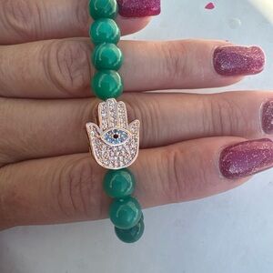 Green tiger eyes bead bracelet with pink hamsa evil eye charm strachtable